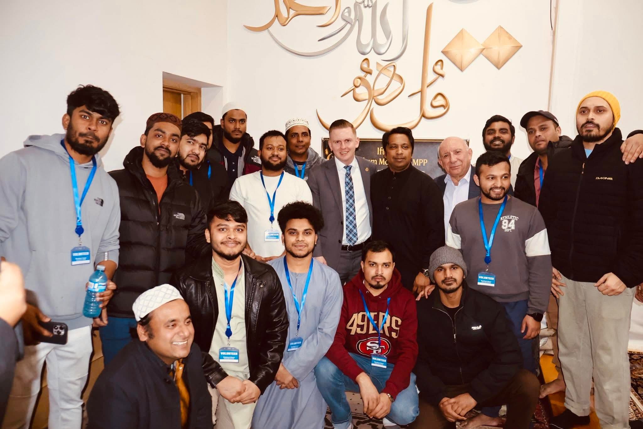 Murshed Nizam with youth volunteers and community members