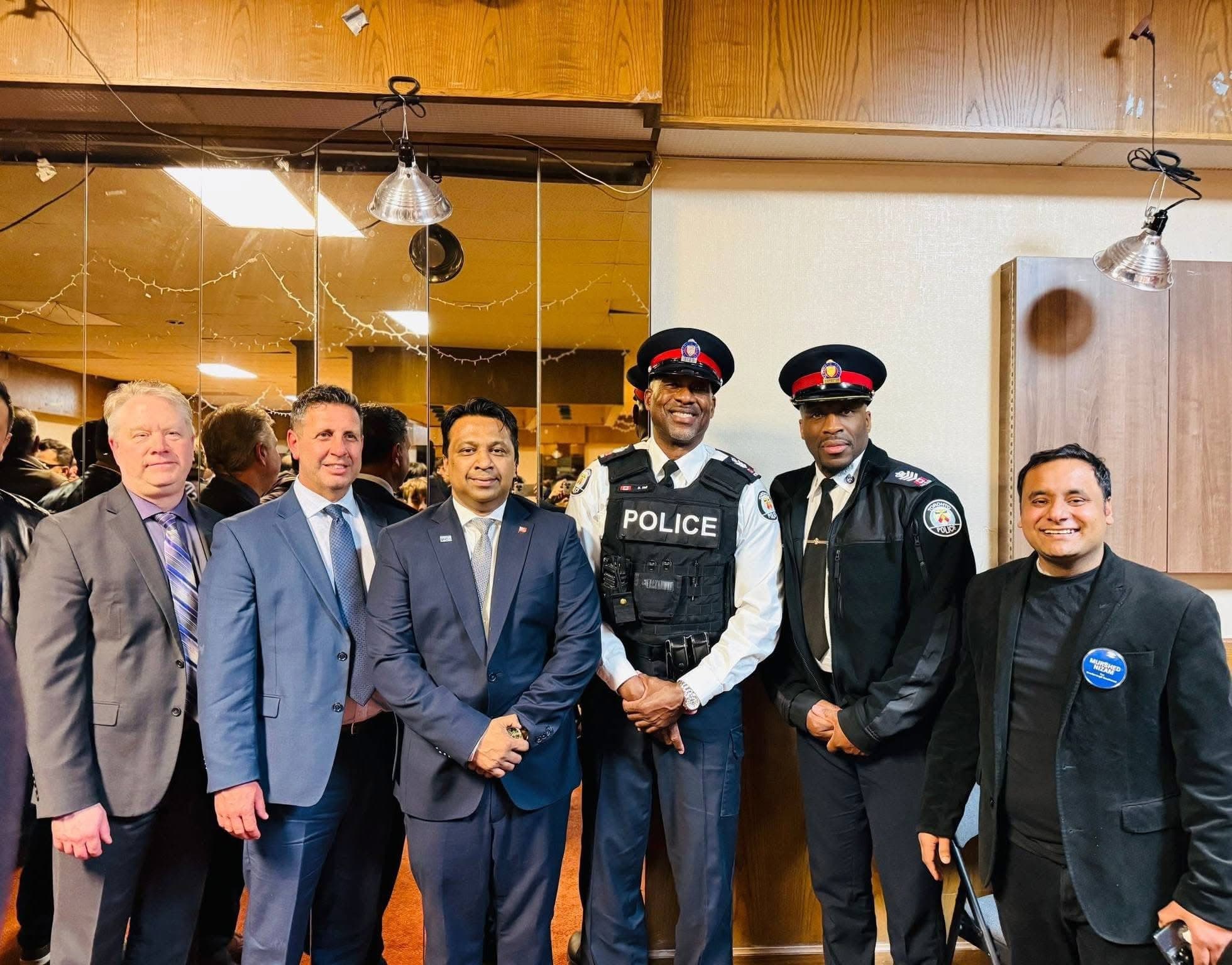 Murshed Nizam with community leaders and Toronto Police representatives