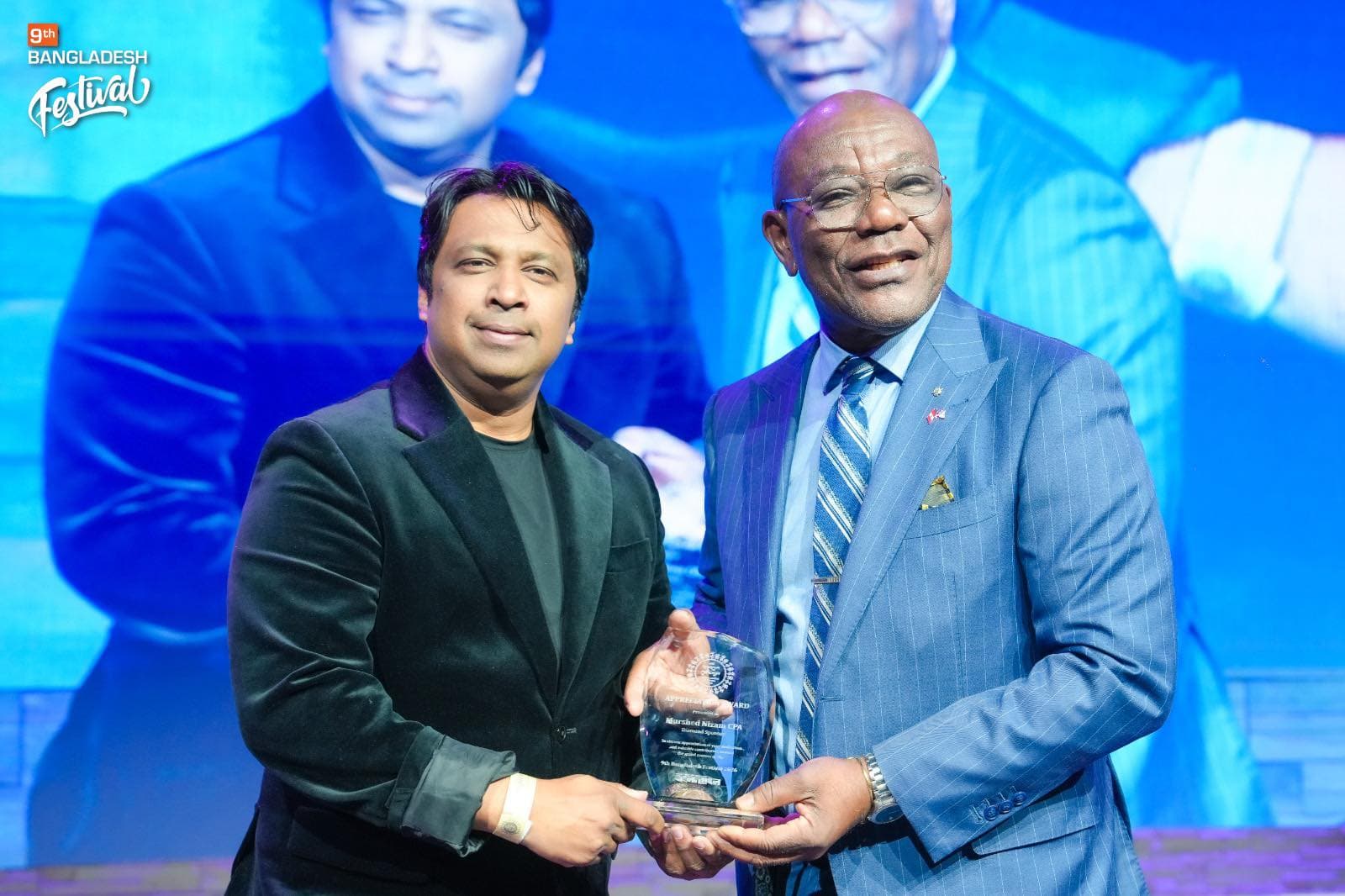 Murshed Nizam receiving community recognition at a cultural event