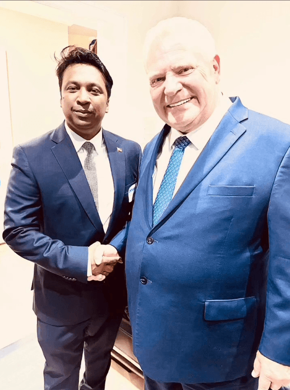 Murshed Nizam shaking hands with Doug Ford